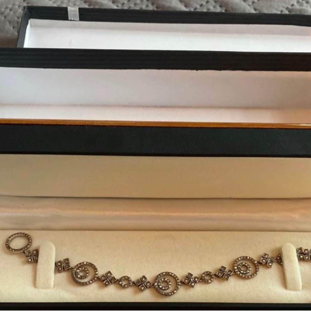 Diamond encrusted bracelet. Never worn, still in a beautiful, wood box.